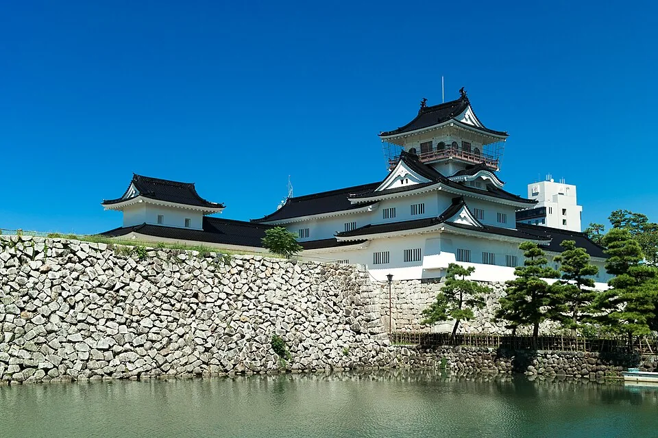 Castle-shaped building and moat at Toyama Castle
