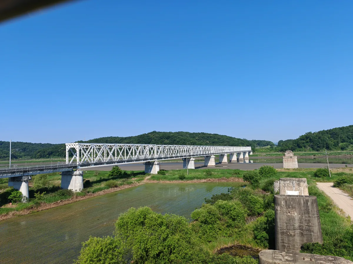 A railway bridge and surviving bridge piers seen from Imjingak